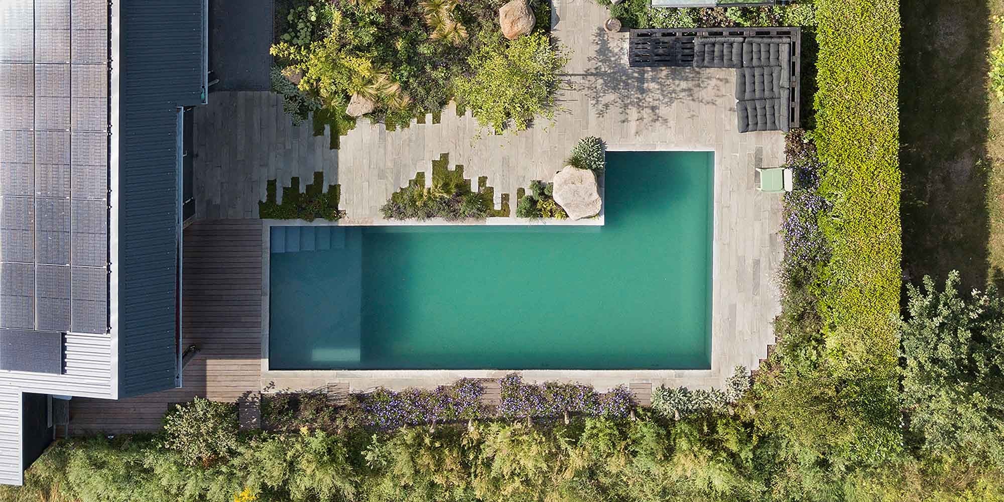 A pool in the Netherlands in the garden photographed from above